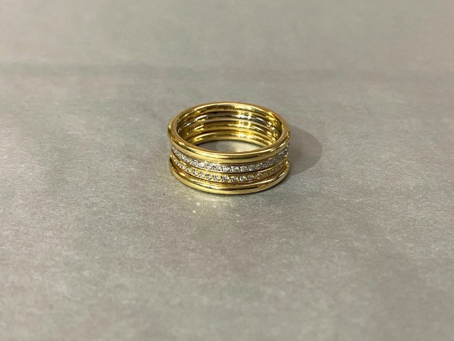 gold rings with diamonds on top of each other